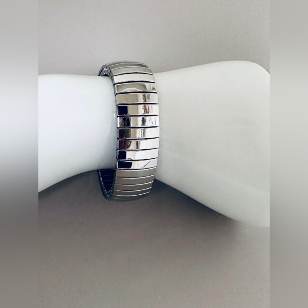 Wide expansion bracelet in silver tone.